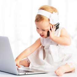 baby girl with computer laptop and mobile phone
